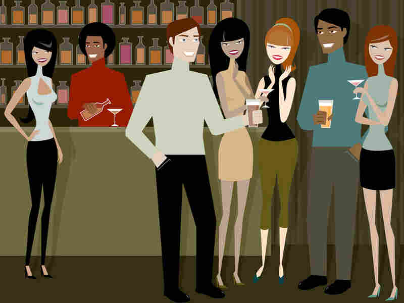 People mingle at a cocktail party.