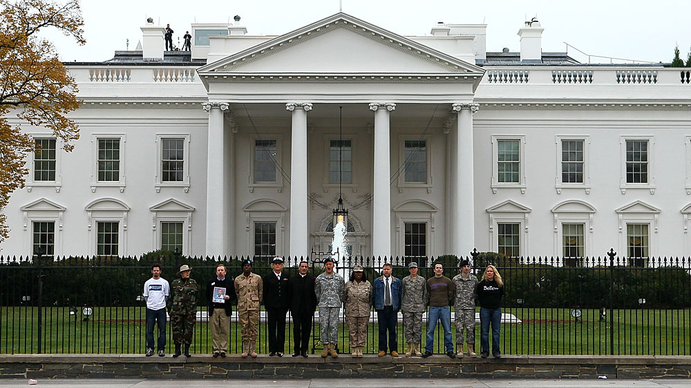Gay-rights activists and gay veterans handcuff themselves to the fence of the White House during a Nov. 15 protest calling for an end to the ban on openly gay Americans serving in the military. (Getty Images)