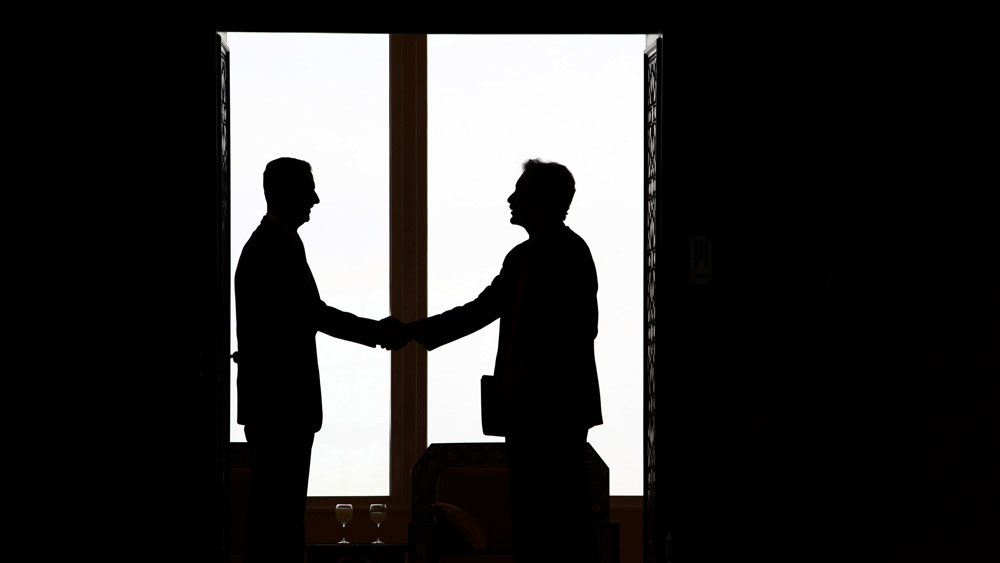 Syrian  President Bashar al-Assad, left,   shakes hands with U.S. undersecretary for  political affairs William Burns, right, ahead of their meeting in Damascus on February 17,  2010. (AFP/Getty Images)