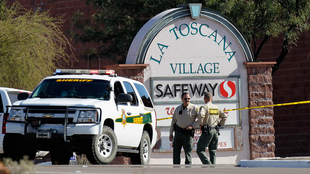 Law enforcement  officials were still trying to piece together a chronology of events and  a possible motive  for Saturday's shooting rampage at a Safeway in  Tucson, Ariz. (Getty Images)