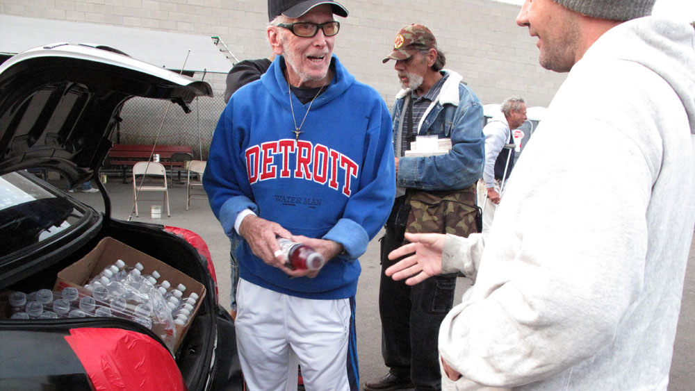 David Ross, also known as Waterman Dave, hands out bottled water and energy drinks from his trunk in San Diego. The 75-year-old retiree has made it his  mission to help the homeless — even if it's just with a hug or a kind  word. (NPR)