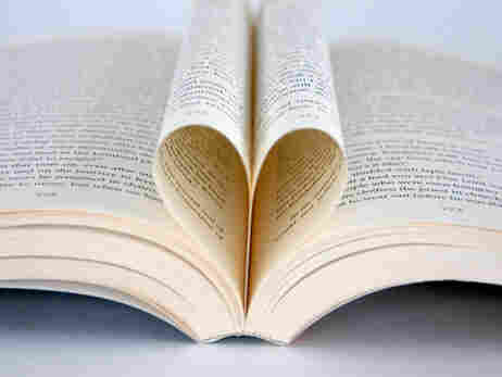 A book with the pages folded into a heart.