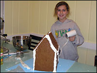 A Gingerbread House Built of Whimsy and Love 2 Forget the hot-glue gun: May, 10, uses a hair-dryer to help transform frosting into concrete.