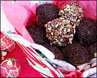 Round choco-nut cookies are nestled in a gift box.