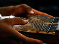 Childo Thomas plays the Kalimba, or thumb piano. (NPR)