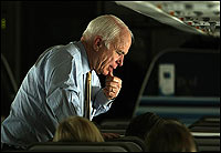 Candidates Woo Texans on Eve of Primaries 2 Arizona Sen. John McCain talks to staff on his campaign plane March 3 during a campaign swing through Texas.