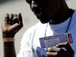 Donte Zierway shows his Michael Jackson wristband and ticket outside Dodger Stadium on Monday. (Getty Images)