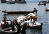 Muslims unload rice at the port of Sittwe, in Myanmar's northern Rakhine state. Nearly 1 million ethnic Rohingya Muslims live in the state, though many are fleeing repression by Myanmar's regime.