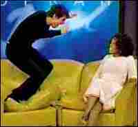Tom Cruise jumps on Oprah's couch