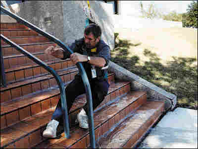 A man slips on a surface sprayed with anti-pirate coating.