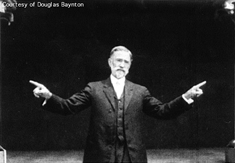 Robert McGregor recording a sermon in sign language on film, 1913.
