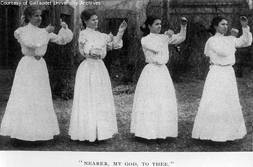 Four Young Women Sign The Hymn, 'Nearer My God To Thee', circa 1890s.
