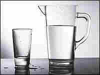 A pitcher and glass of water.