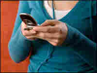 Woman texting on cell phone.