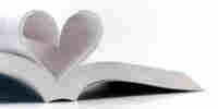 Book with pages making the shape of a heart.