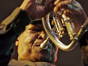 Hugh Masekela performs on the fluegelhorn in Kenya in 2007. He says he was inspired by a recording of Miles Davis playing the instrument. &quot;He got that fat, dark, rich tone,&quot; Masekela says. &quot;And I decided to go buy a fluegelhorn right there and then. I haven't blown the trumpet since.&quot; (AFP/Getty Images)